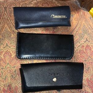 3 small eye glass cases